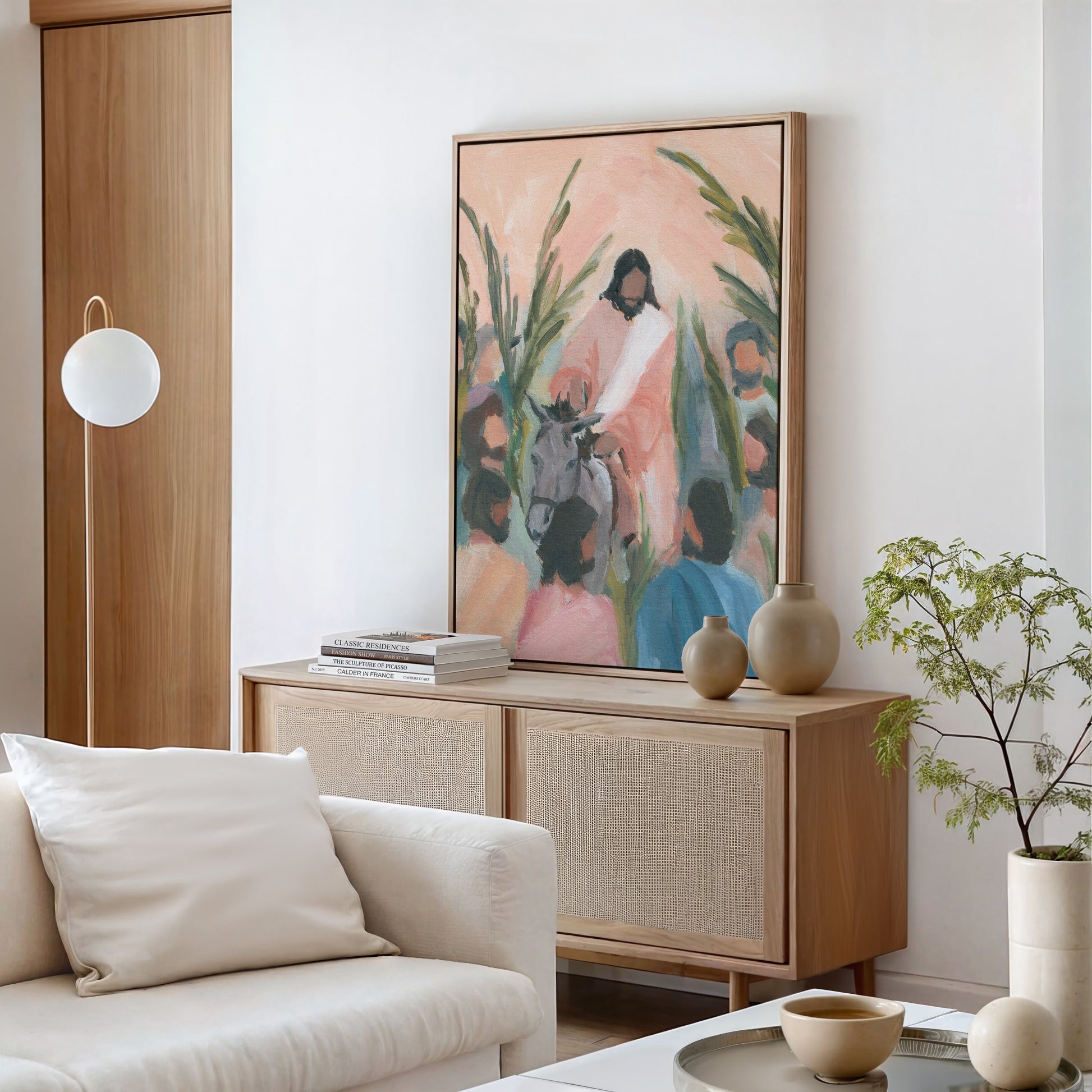 framed canvas print of Jesus on donkey styled in living room