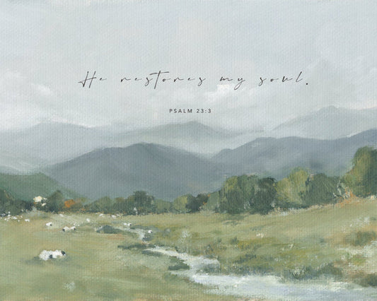 A peaceful Christian painting of a green pasture with quote from Psalm 23