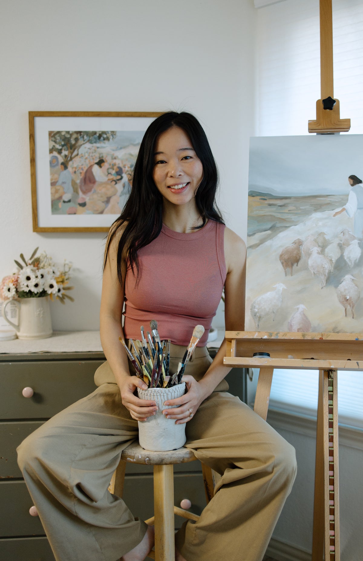 Artist and Founder of Made Seen Joy Gonzales in her studio