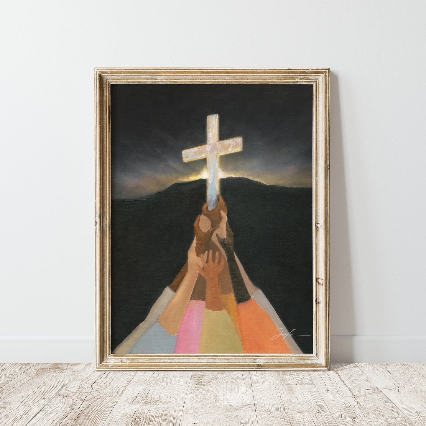 Christian wall art print of diverse colorful hands lifting up the cross in darkness, with a dark mountain and morning light rising behind it.