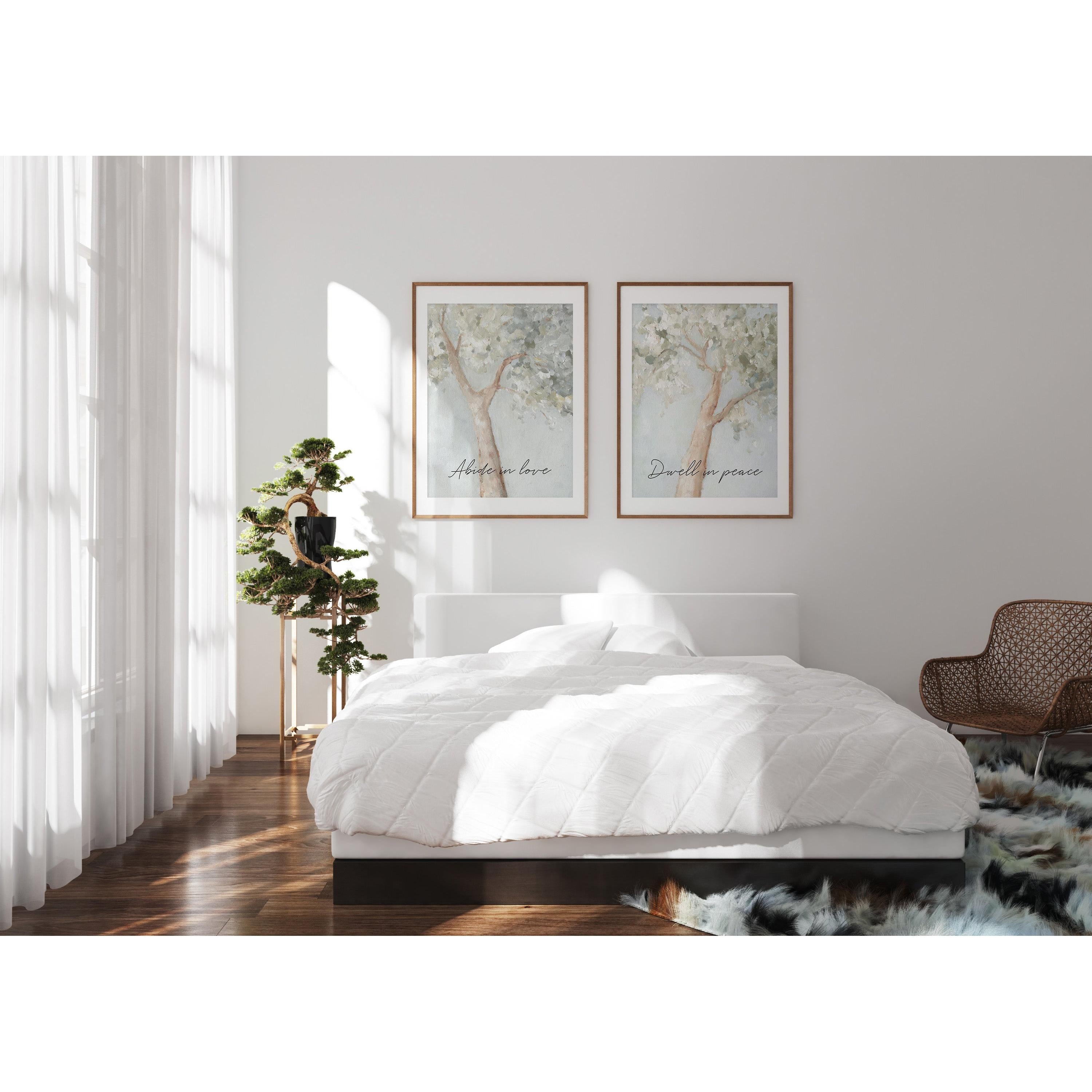 two framed calming Christian artworks on the wall a bright bedroom