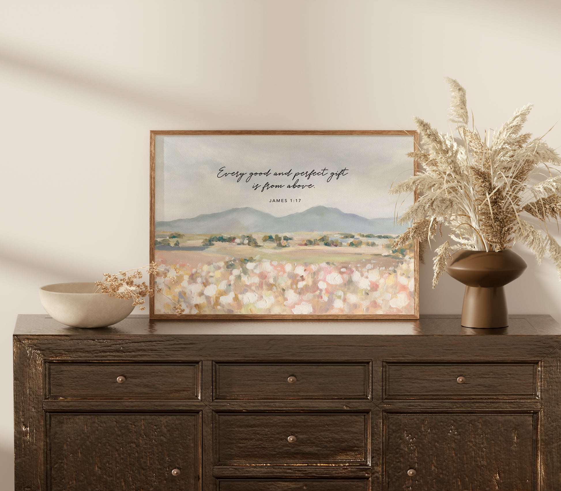 Framed Christian art of Floral field landscape wall art with mountains in the distance featuring James 1:17 Scripture