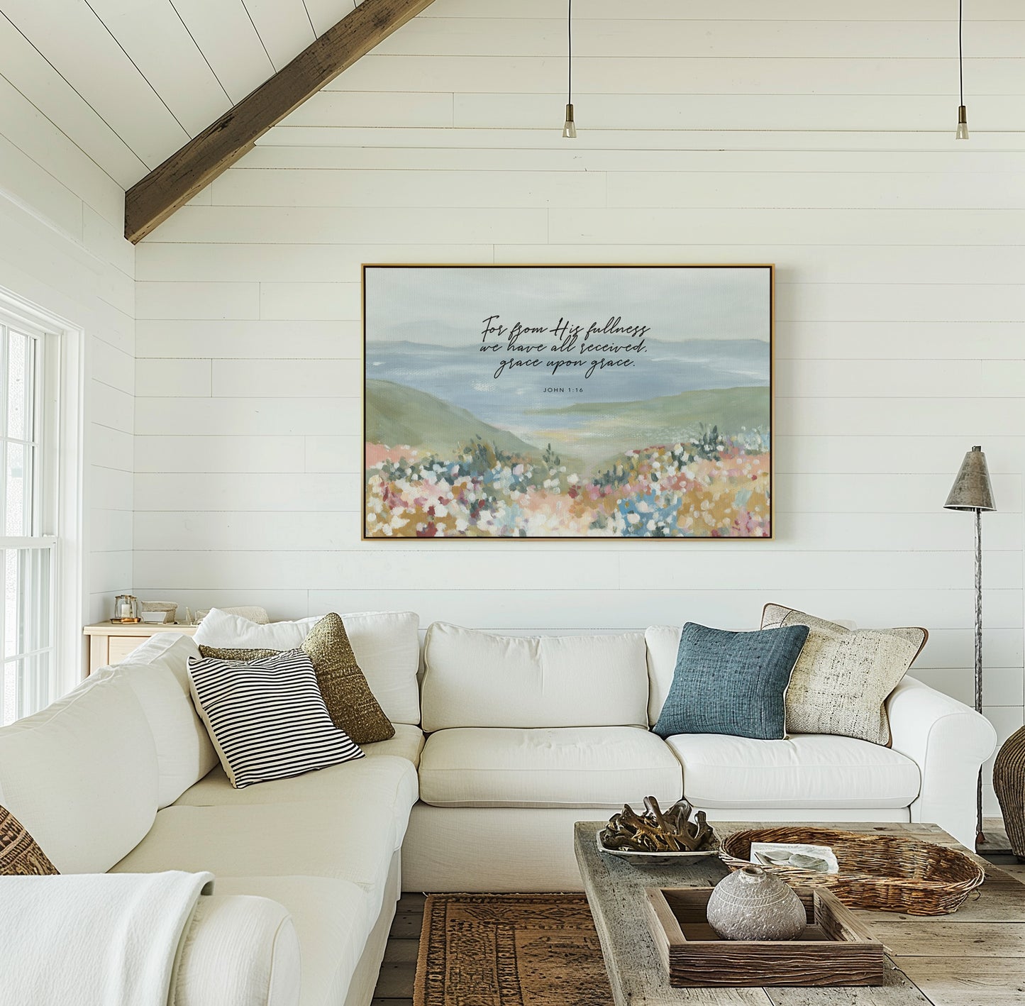 Framed canvas Christian art above couch Floral foreground with ocean landscape wall art featuring John 1:16 grace upon grace Scripture