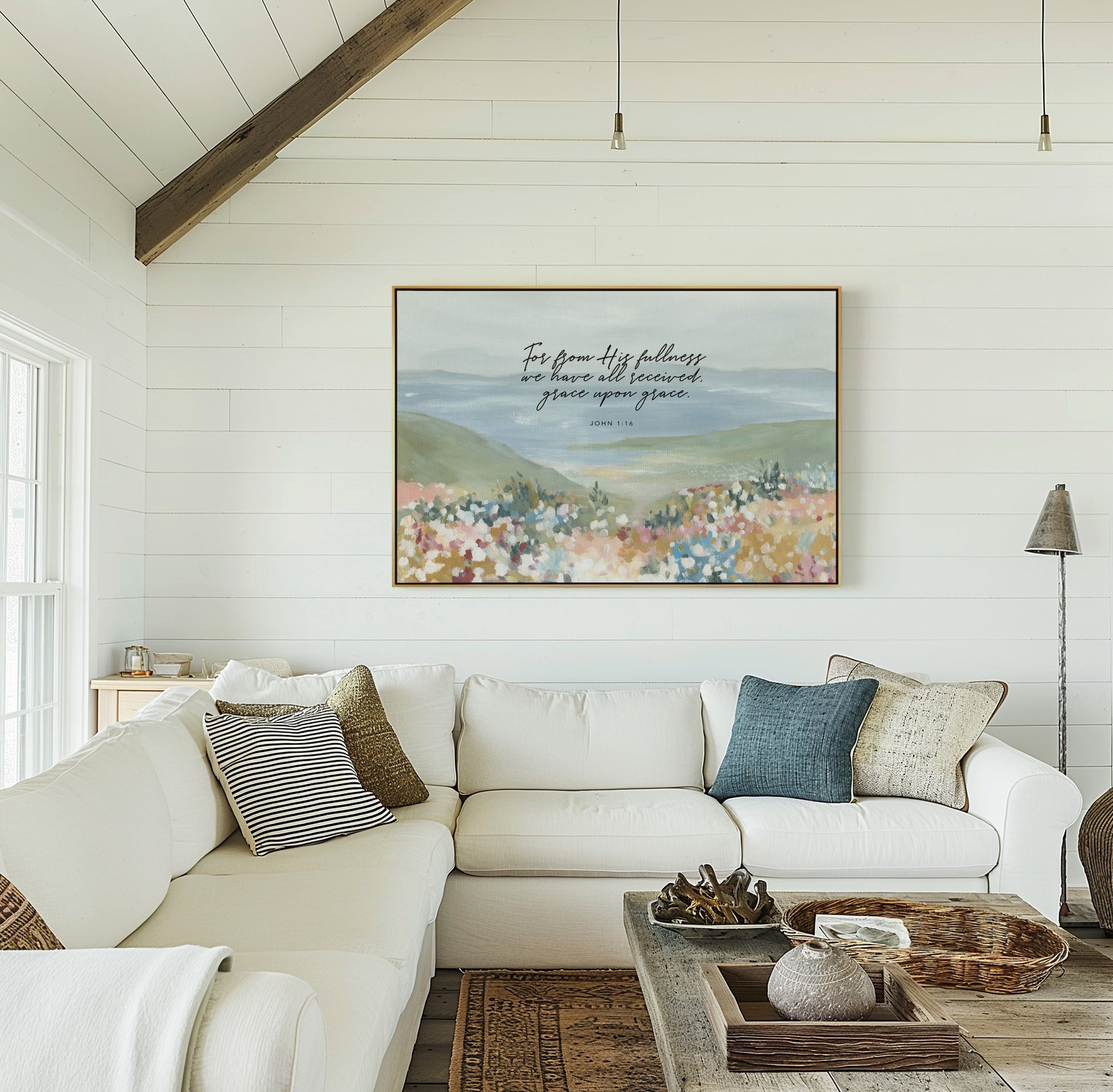 Framed canvas Christian art above couch Floral foreground with ocean landscape wall art featuring John 1:16 grace upon grace Scripture