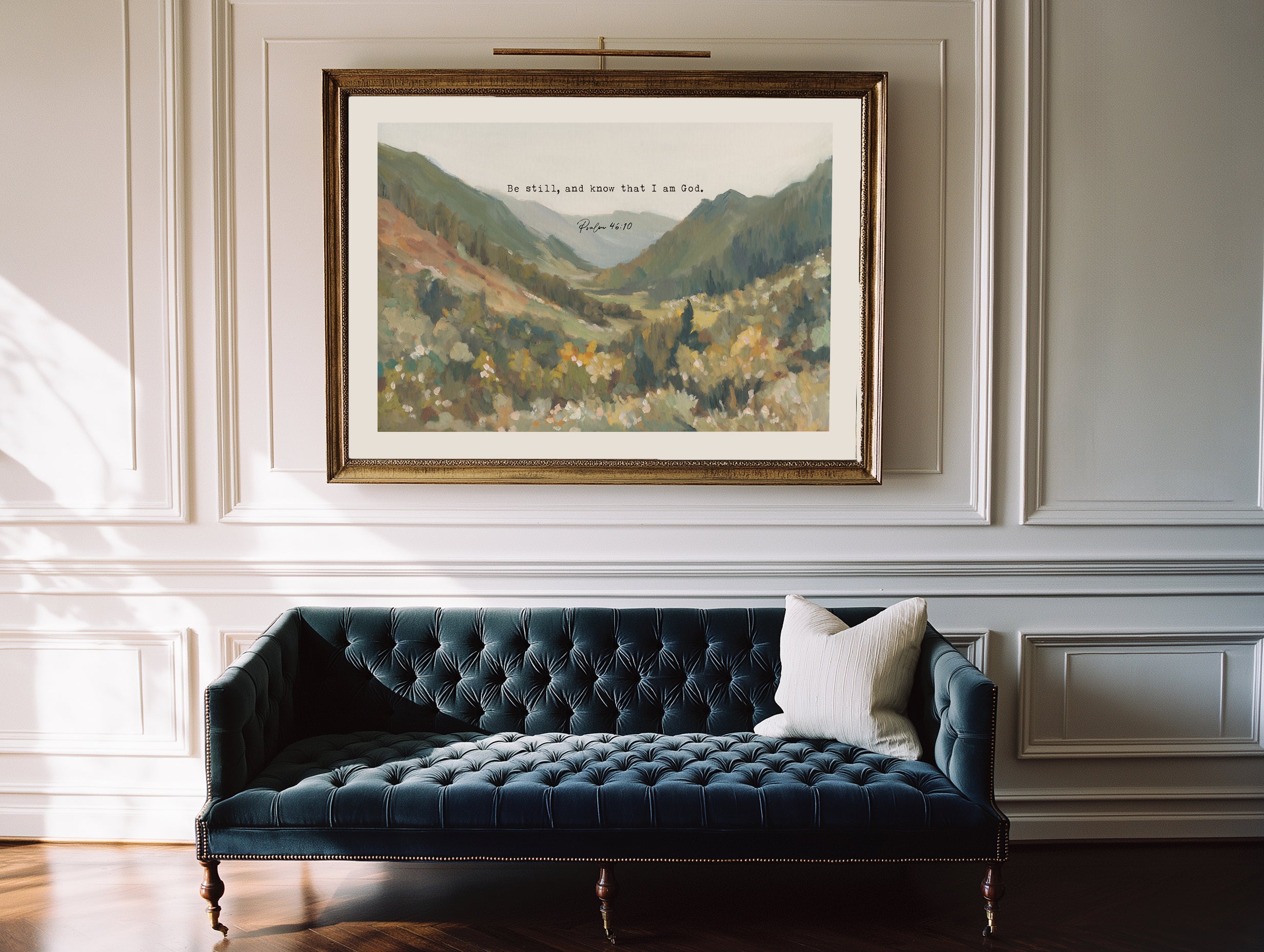 A framed Mountain landscape painting with Bible verse quote "be still and know" on living room wall decor