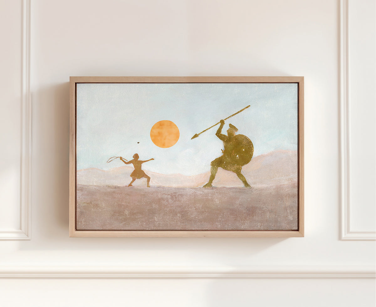 A framed canvas art print depicting a stylized ancient battle scene of David and Goliath  -young David releasing a sling stone toward the armored giant beneath an orange sun.
