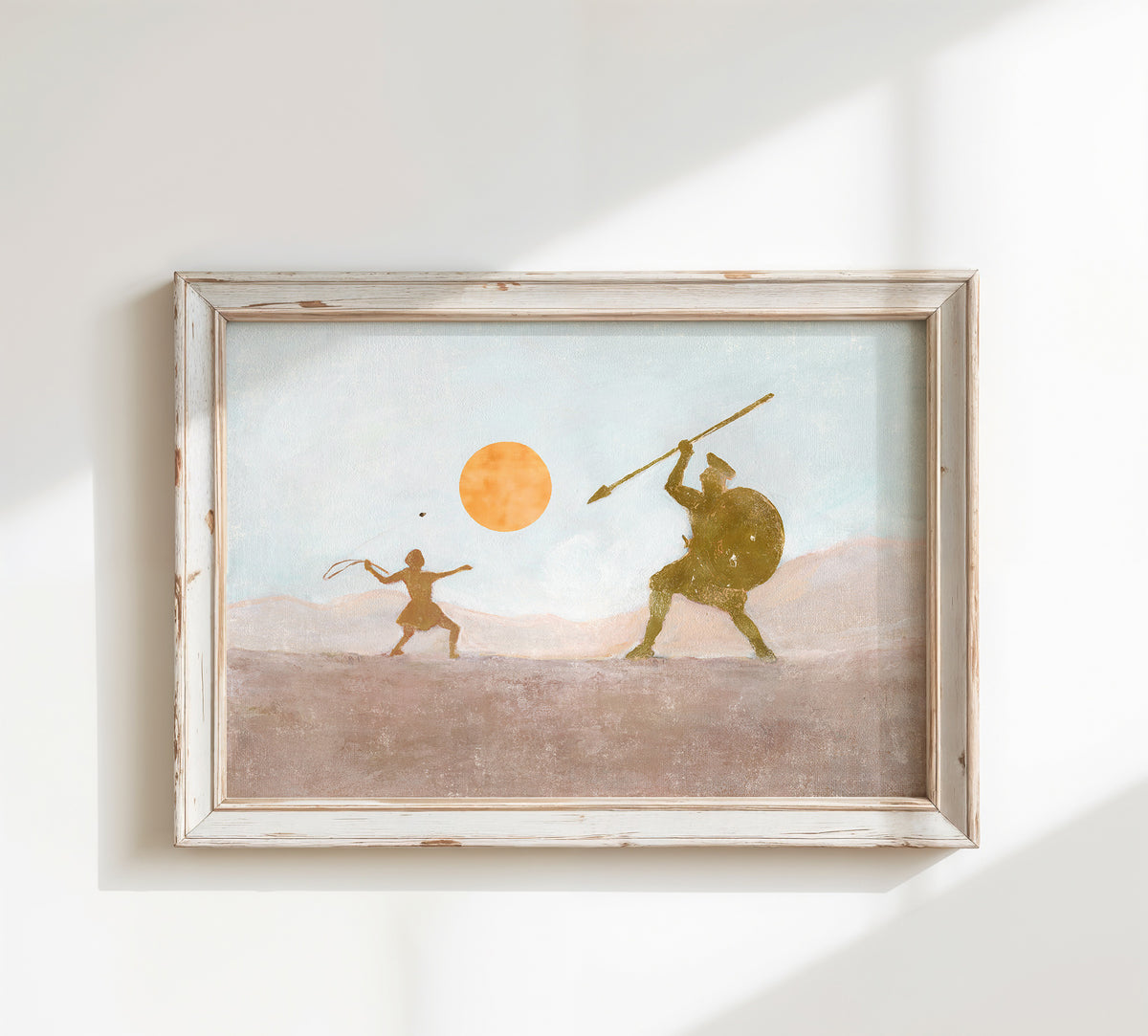 A framed art print depicting a stylized ancient battle scene of David and Goliath  -young David releasing a sling stone toward the armored giant beneath an orange sun.
