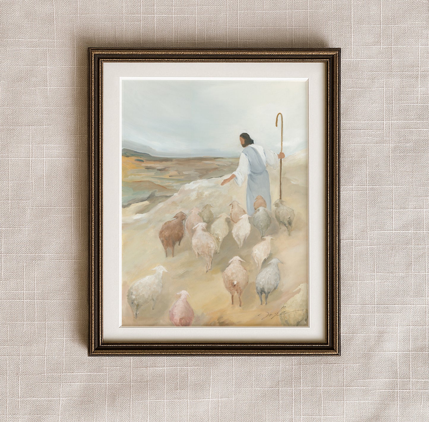 The Good Shepherd Christian art print in an antique bronze frame, showing Jesus leading His flock across a peaceful hillside.