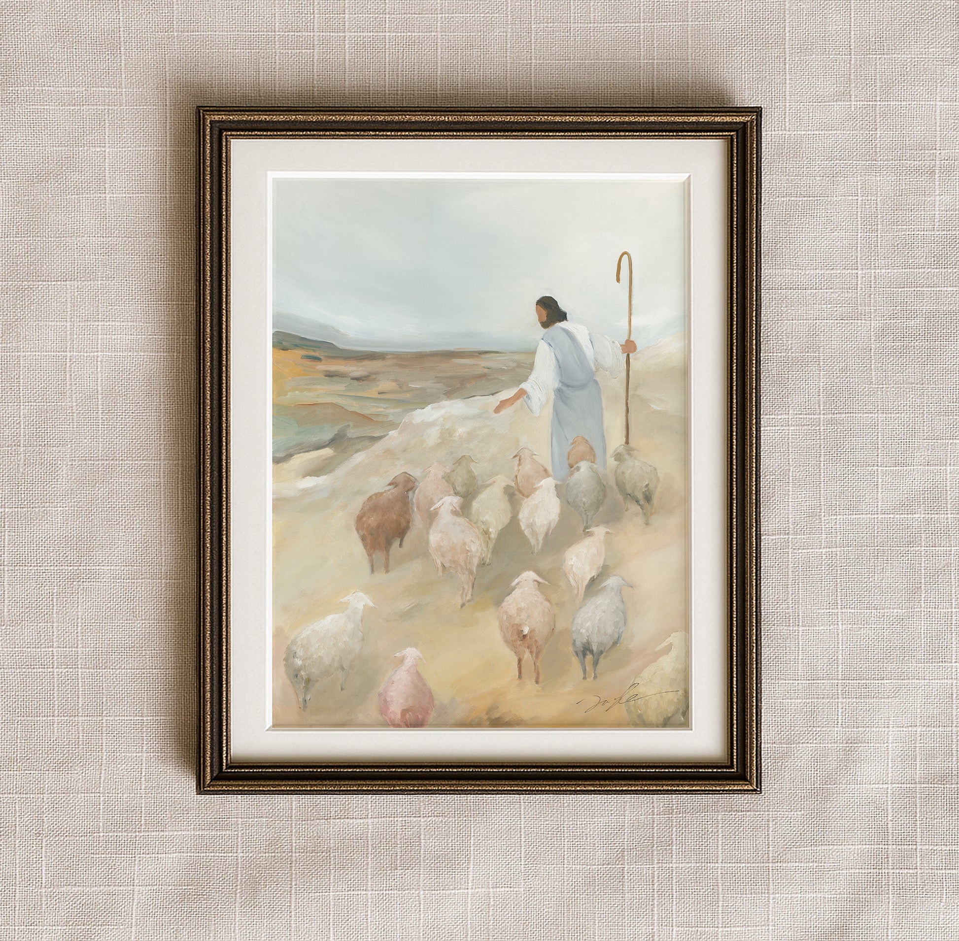 The Good Shepherd Christian art print in an antique bronze frame, showing Jesus leading His flock across a peaceful hillside.