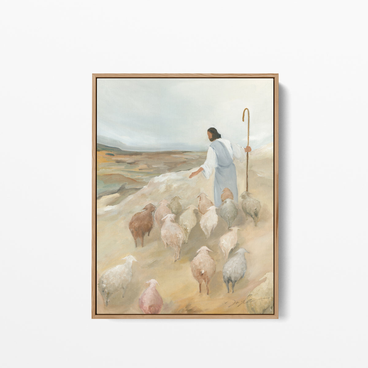 Jesus the Good Shepherd wall art in a natural wood frame, depicting Christ leading a flock of sheep.