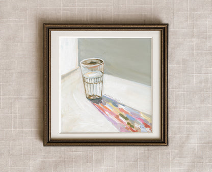 Painting of a glass of water casting a long colorful shadow, with Matthew 10:42 written beside it, framed in a antique bronze frame.