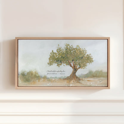 A framed Psalm 52:8 Christian wall art featuring a hand-painted olive tree and the words “I trust in God’s unfailing love forever and ever.”